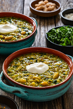 Aash-e Jow - persian barley soup on wooden table