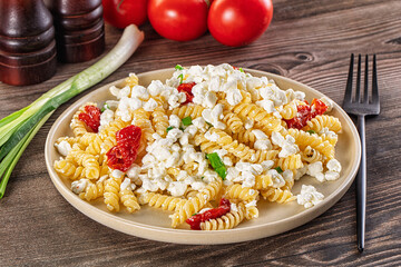 Italian pasta fusili with curd