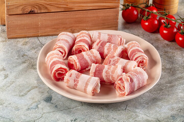 Raw bacon pork roll sliced