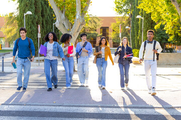 Diverse students walking on campus after classes