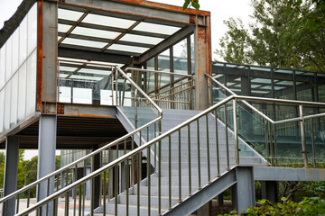 Modern steel and glass structure with metal staircase