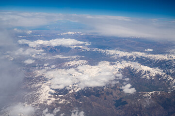 Bati raman mountains, batman river, Tigris, southeast Turkey, aerial view, clouds over snow covered mountain and valley with riverbed