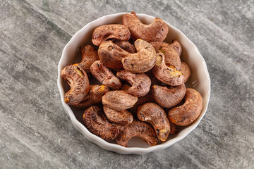 Unpeeled cashew nuts in the bowl