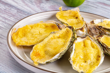 Baked oyster with parmesan cheese