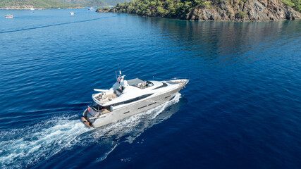 A private yacht cruising on calm waters