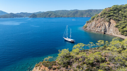 Beautiful aerial view of a classic Turkish gulet sailing in the calm Aegean Sea.