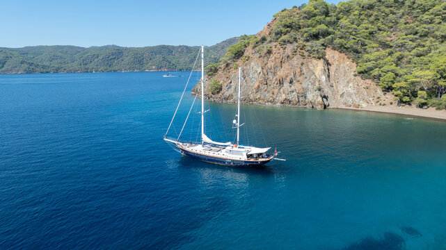 Beautiful aerial view of a classic Turkish gulet sailing in the calm Aegean Sea.