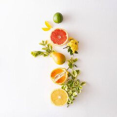 Creative layot made of summer tropical fruits,leaves and yellow flowers.Flat lay.Food concept