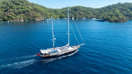 Obraz premium A peaceful cruise through blue horizons on a luxury gulet yacht.