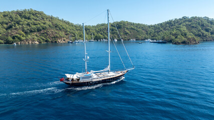 Obraz premium A peaceful cruise through blue horizons on a luxury gulet yacht.