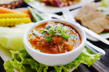 Delicious spicy northern Thai pork and tomato in white bowl. Traditional of Thai food