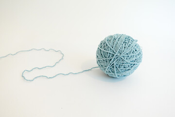 Light Blue Ball of Yarn on White Minimal Background