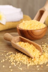 Natural sea salt on wooden table, closeup