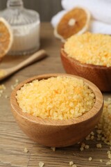 Natural sea salt on wooden table, closeup