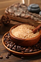 Natural sea salt and coffee beans on wooden table, closeup