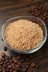Natural sea salt and coffee beans on wooden table, closeup
