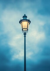 Vintage streetlamp glows softly against a muted sky