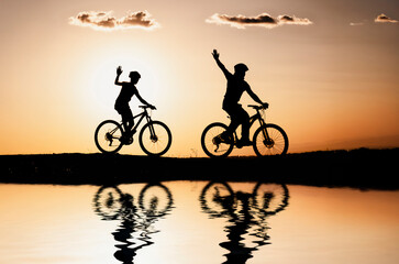 Two mountain bike riders having a great time in nature