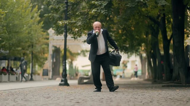 Old drunk office worker walking with bottle showing social problem