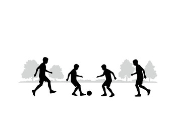 Fototapeta premium Silhouette of four boys playing soccer in a park with trees in the background.