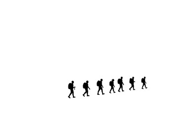 Fototapeta premium Silhouetted group of hikers with backpacks walking in a line against a white background.