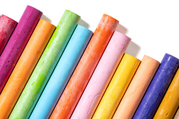 Vivid oil pastels for drawing and art projects, macro close-up with natural shadows. Transparent PNG background, creative supplies, school and art studio materials.