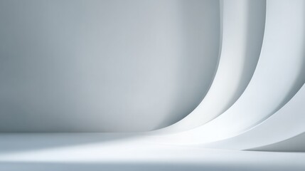 Minimalist interior design featuring smooth, curved white walls and soft lighting creating a serene atmosphere