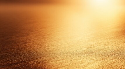 Golden sunset reflecting on calm water surface, creating serene atmosphere with soft ripples