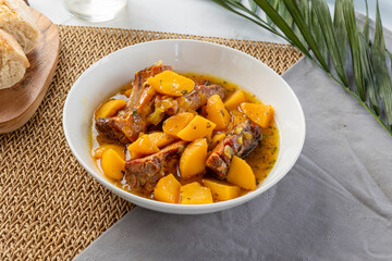 Hearty pork spare ribs and potato stew serving