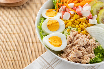 Tuna salad bowl with boiled eggs and fresh vegetables