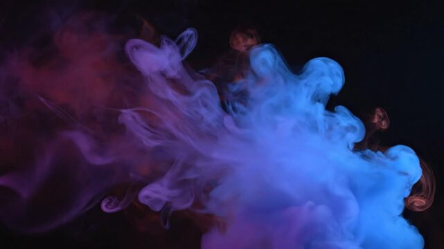 Abstract swirling clouds of vibrant pink and blue smoke against a dark background, creating a dynamic and ethereal visual