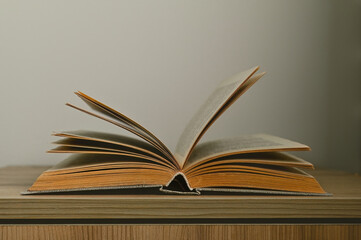 An old book on the bedside table.