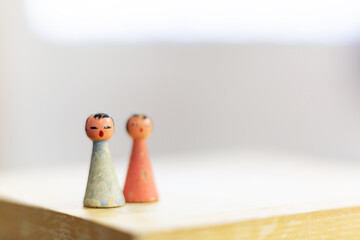 Two little dolls. Retro toys, with space for your logo or text.