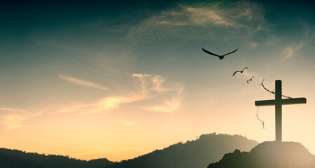 Silhouette of Jesus with Cross over sunset concept for religion, worship, Christmas, Easter, Redeemer Thanksgiving prayer and praise