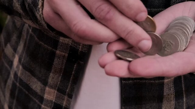 closeup male hands hold Moroccan dirham money, centimes coins, count paper dirham banknotes, concept cash payments, monetary savings, exchange and cashing currency
