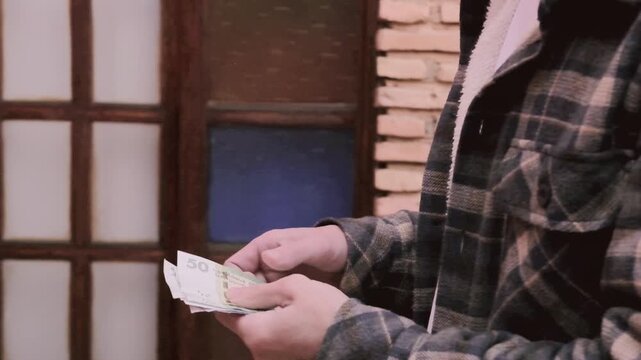 closeup male hands hold Moroccan dirham money, count paper dirham banknotes, concept cash payments, monetary savings, save for vacation, exchange and cashing currency