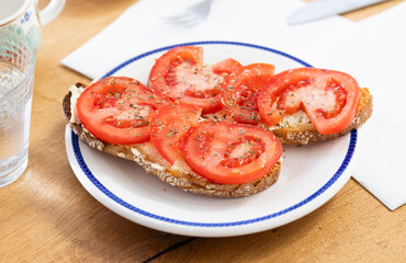 delicious bruschetta with fresh tomatoes on ciabatta slices on a plate