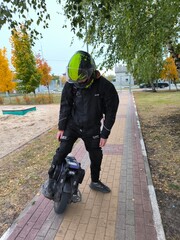 Fototapeta premium young man, multi-wheel, electric wheel, clothes, helmet