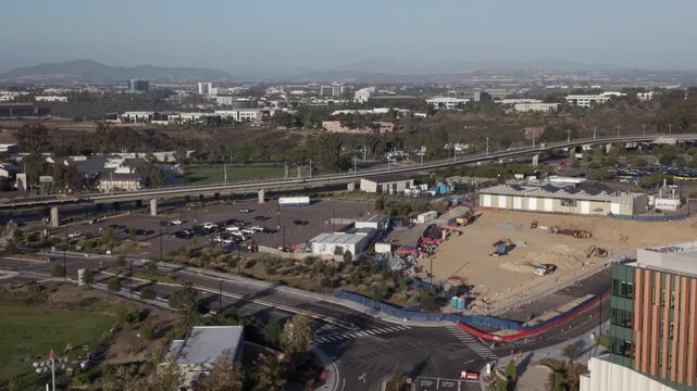 The new San Diego blue line trolley station platform at UCSD Medical Center on Nobel Drive. Wide aerial shot.