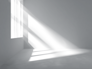 Interior scene with light from a window casting shadows across a smooth floor