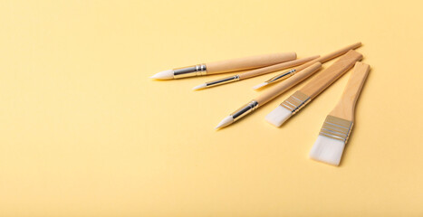 Collection of new paintbrushes of various sizes and styles for painting, crafting, art projects, and detailed hobby work. Tools of artist. New brush set. Drawing tassel variety. High quality photo.