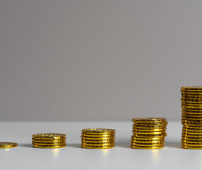 golden coins on a stack of coins