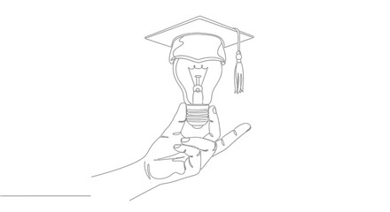 Hand holding a lightbulb with graduation cap, symbolizing knowledge and bright ideas