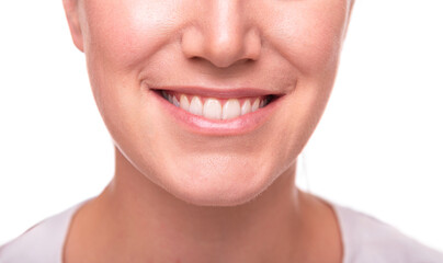 Close-up image of a smiling woman showing her white teeth and natural lips, representing happiness, confidence, and dental health.