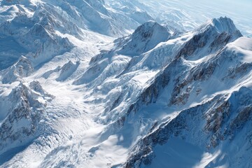 Obraz premium Aerial View of Snow-Covered Mountain Range