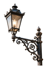 Ornate Black Wrought Iron Street Lamp with Glowing Bulb, Transparent Background, Vintage Design Element