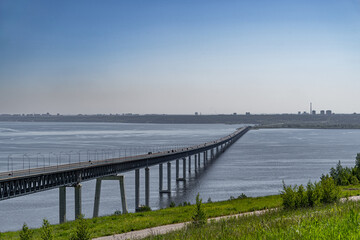 The long bridge across the wide Volga River on high concrete foundations in Ulyanovsk, Russia is called the Presidential Bridge