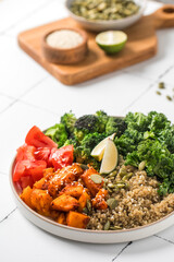 Healthy vegan Buddha bowl with quinoa, pumpkin and seasonal vegetables. Vegetable recipes.