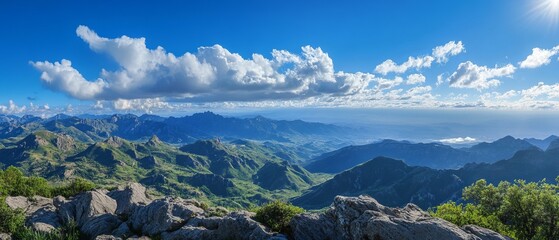 Panoramic mountain vista with expansive valley views and dramatic sky
