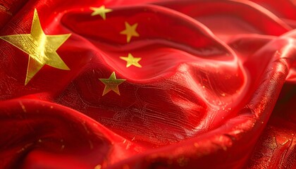 Close-up of a draped Chinese flag featuring a red background and five golden stars, creating a textured and patriotic display.